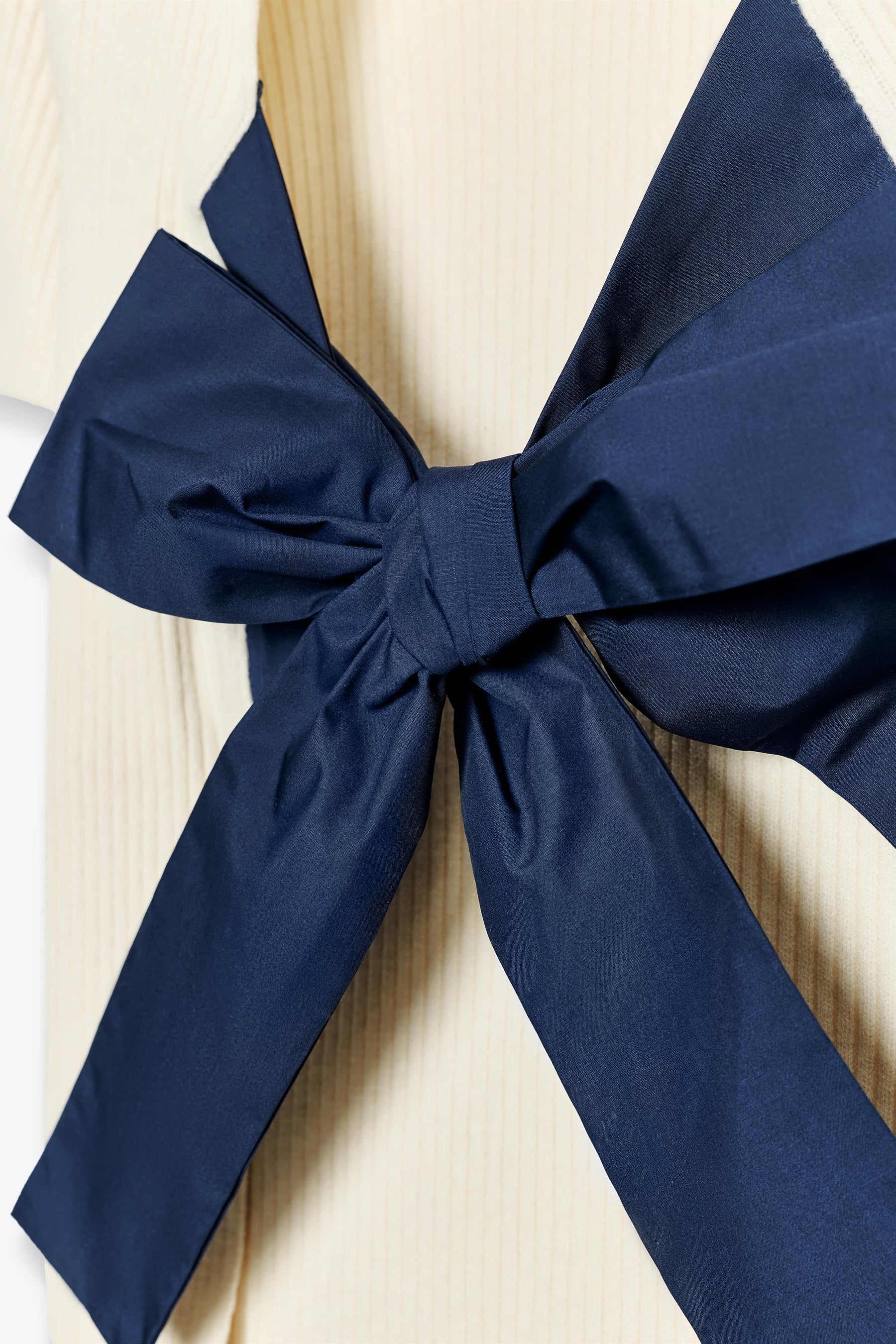 Knit jumper with bow