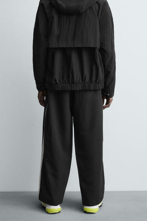 TECHNICAL TROUSERS WITH TAPING - Image 3