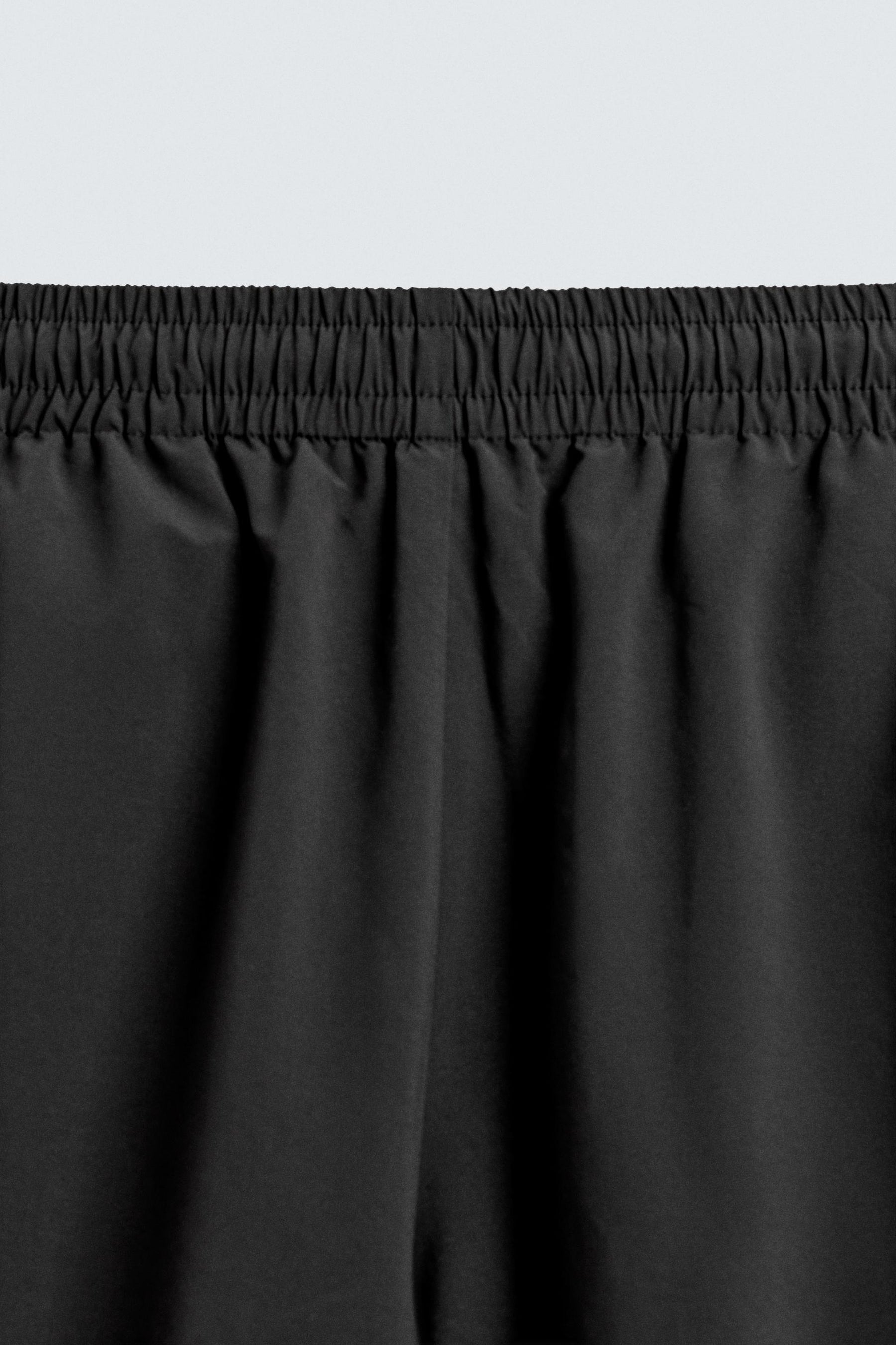 TECHNICAL TROUSERS WITH TAPING - Image 9