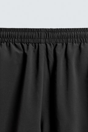 TECHNICAL TROUSERS WITH TAPING - Image 9