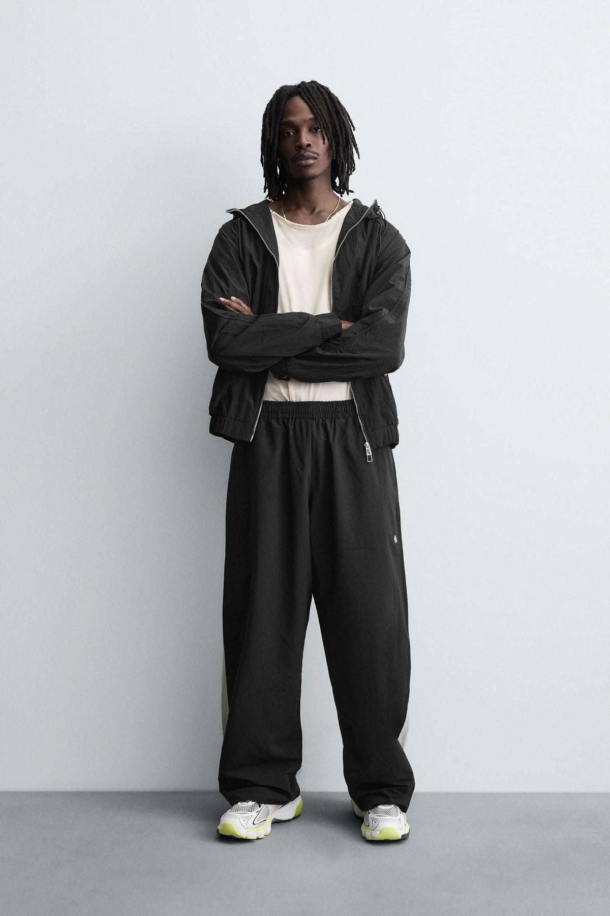 TECHNICAL TROUSERS WITH TAPING - Image 1