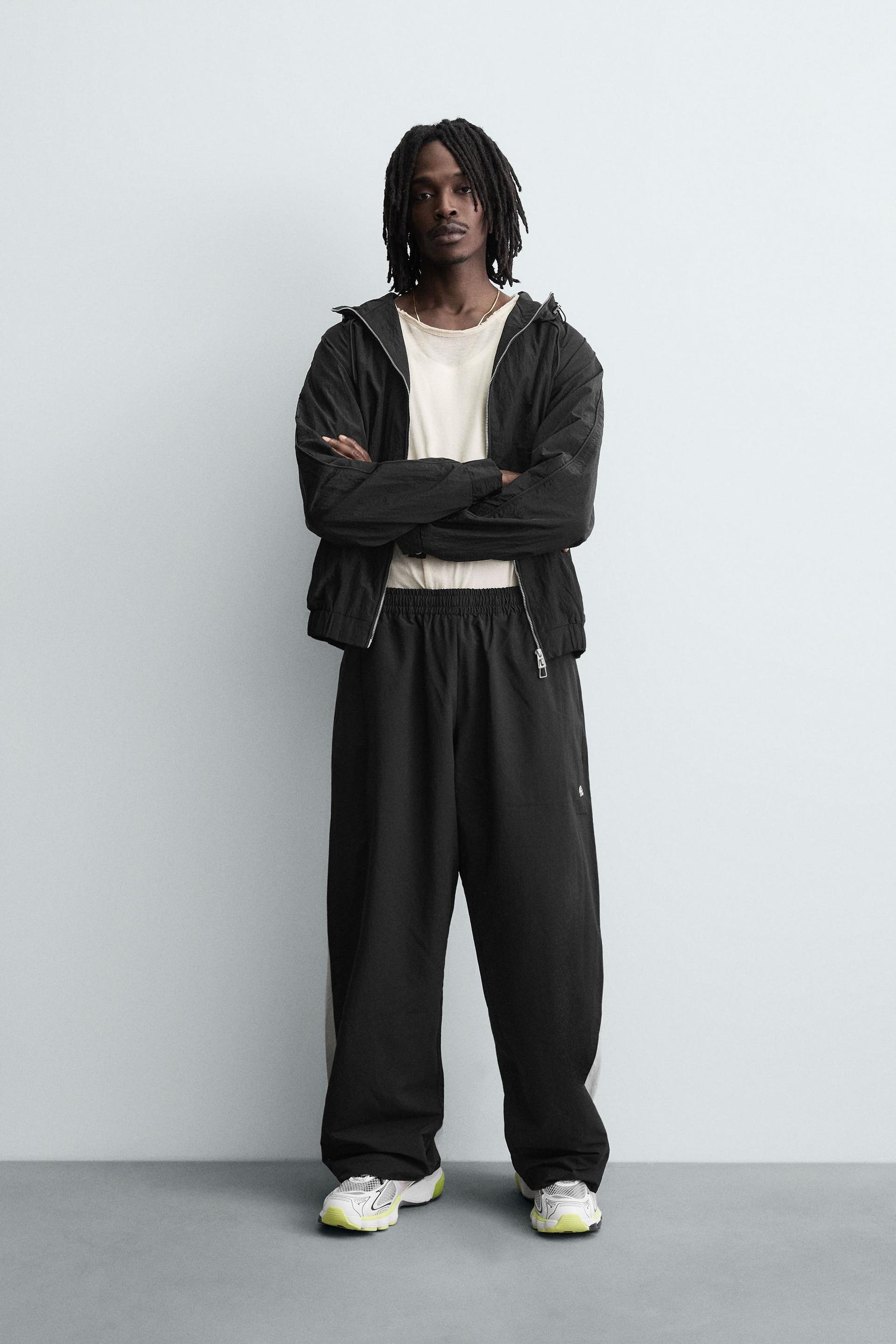 TECHNICAL TROUSERS WITH TAPING - Image 1