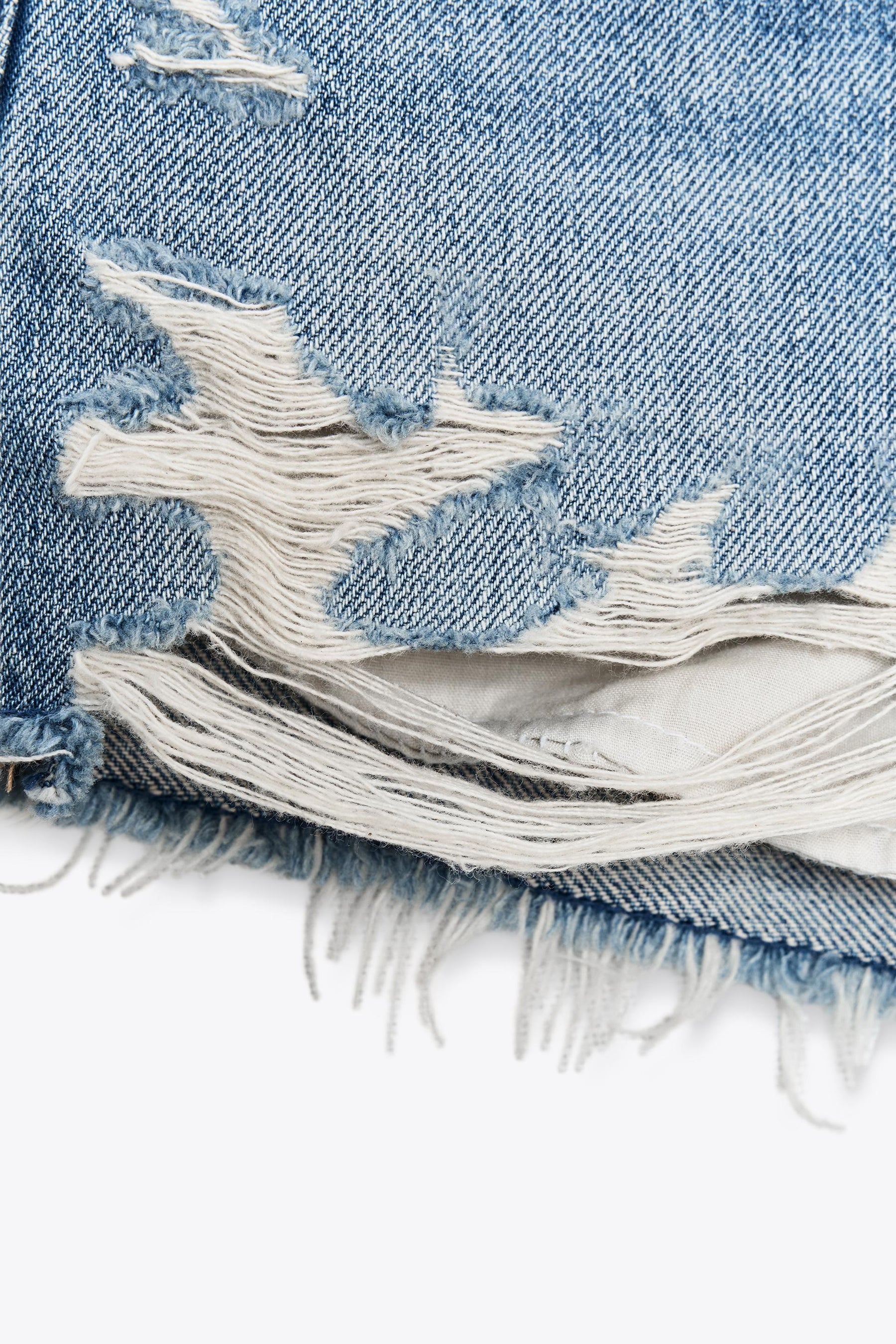 Ripped mid-waist denim shorts