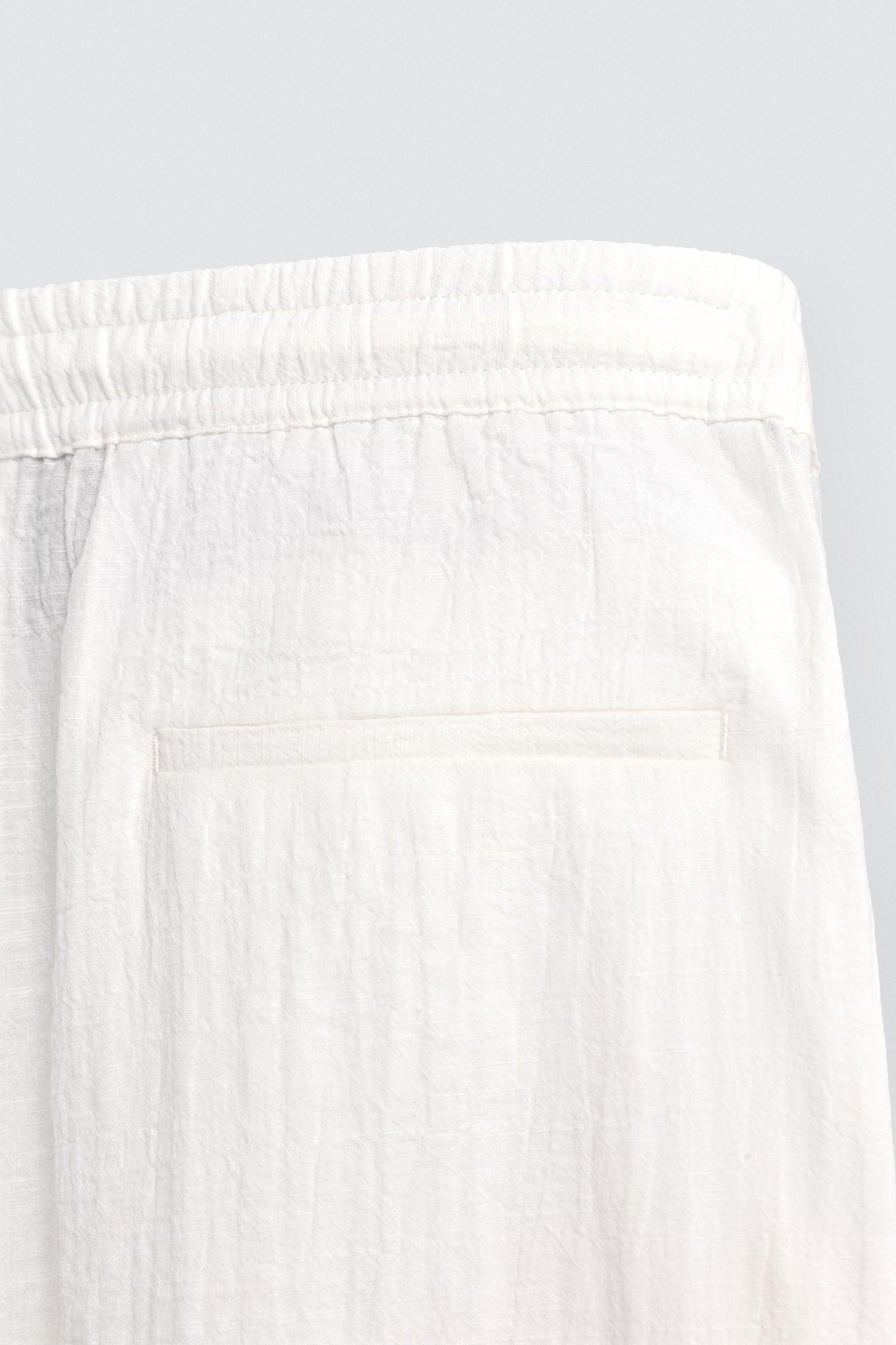 TEXTURED RELAXED FIT TROUSERS - Image 9